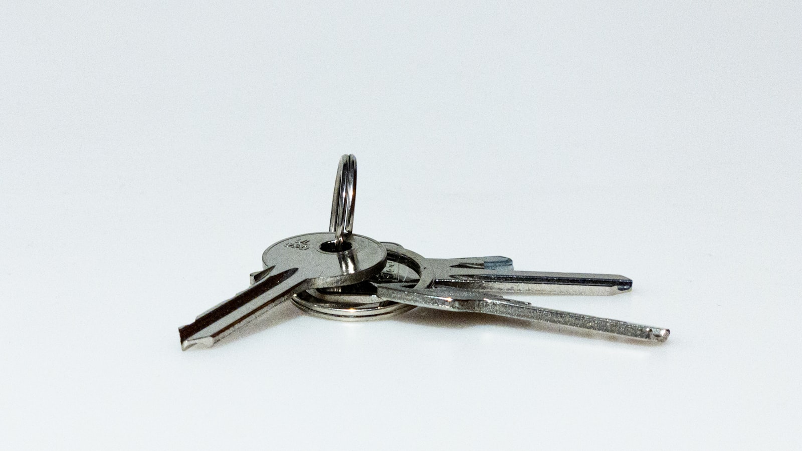 Three silver keys on a keyring